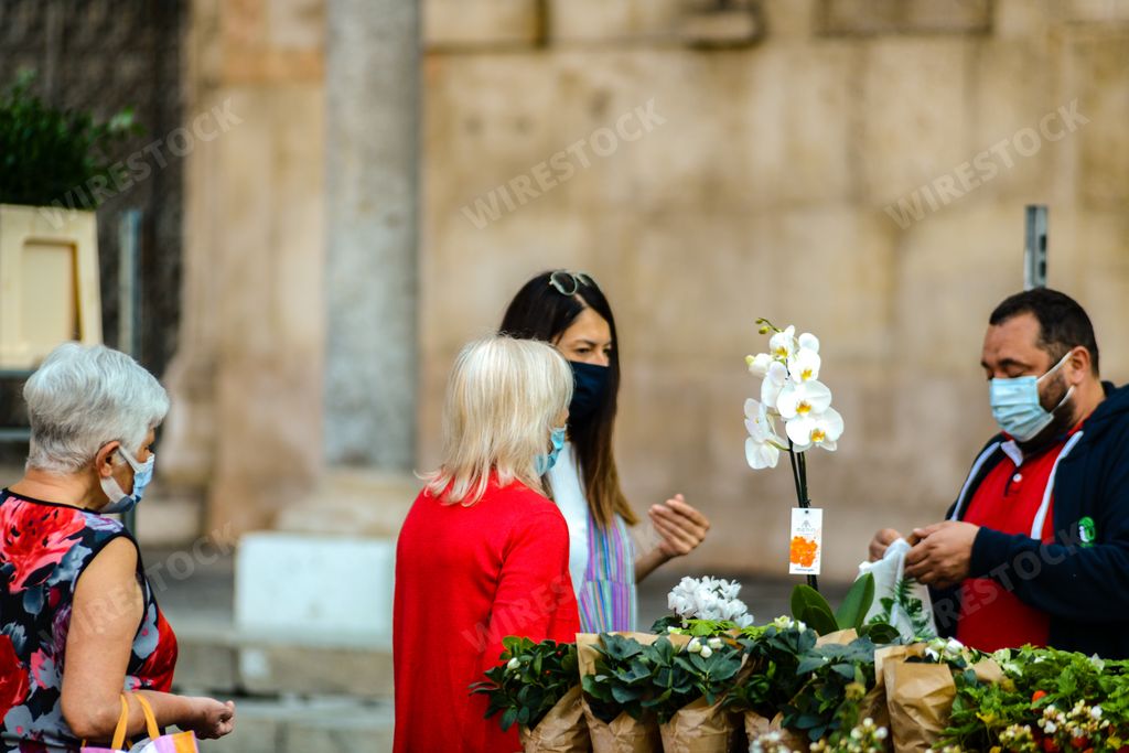 Cremona, Lombardy, Italy. Fresh flower and plant market saturday morning gather people moslty seniors wearing face masks