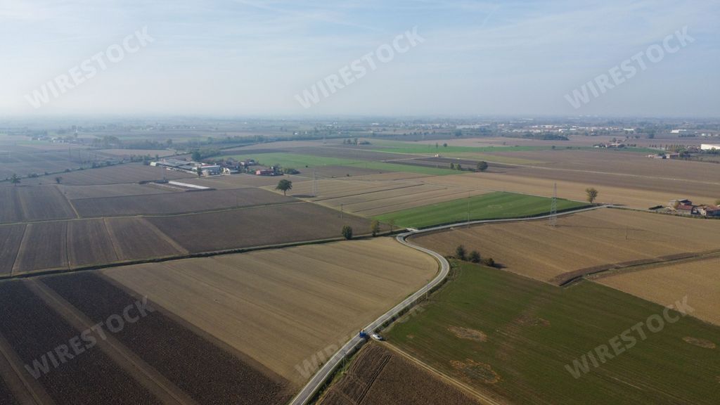 aerial view of rural ground farms and solar energy panels