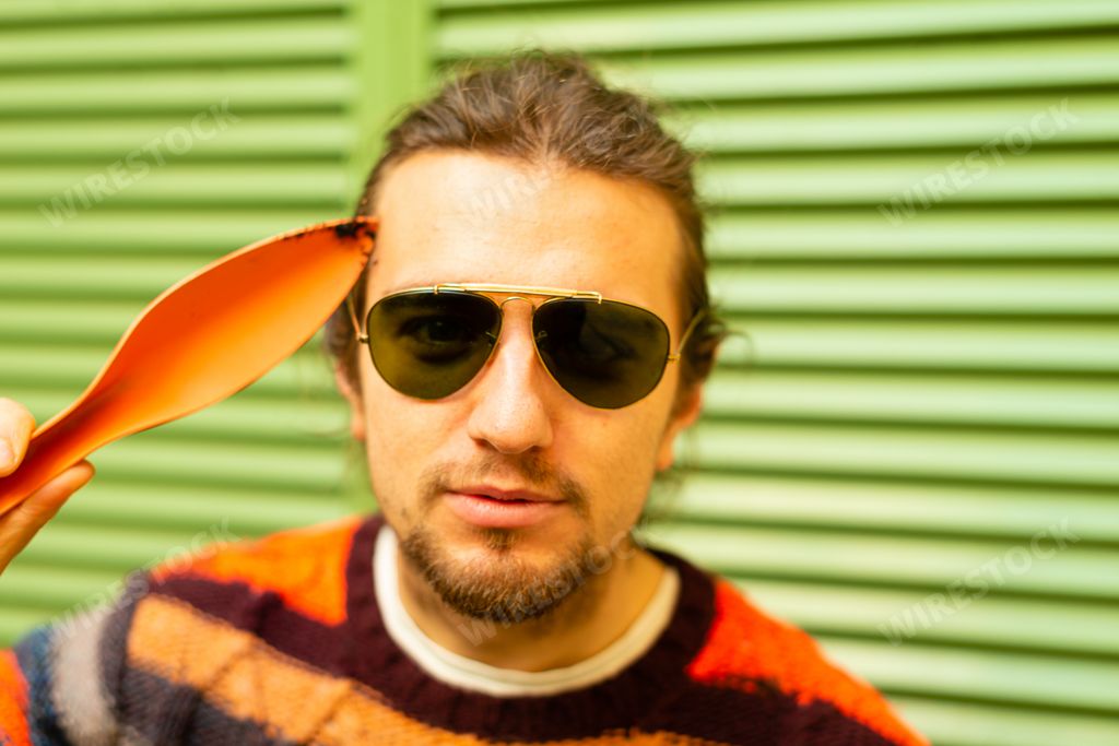 Young caucasian european man with gardening ikea tools