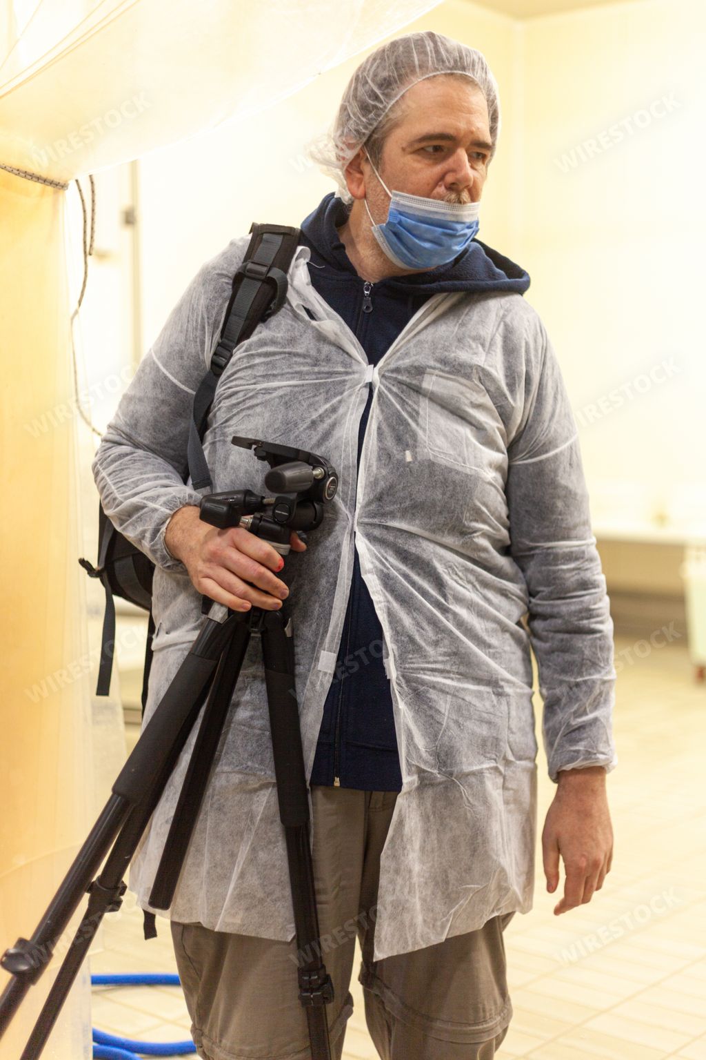 A photographer and videomaker in cheese manufacturing farm in Italy