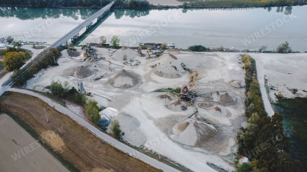 Top view of large manufacturing plant in landscape by the river Po, Piacenza Italy