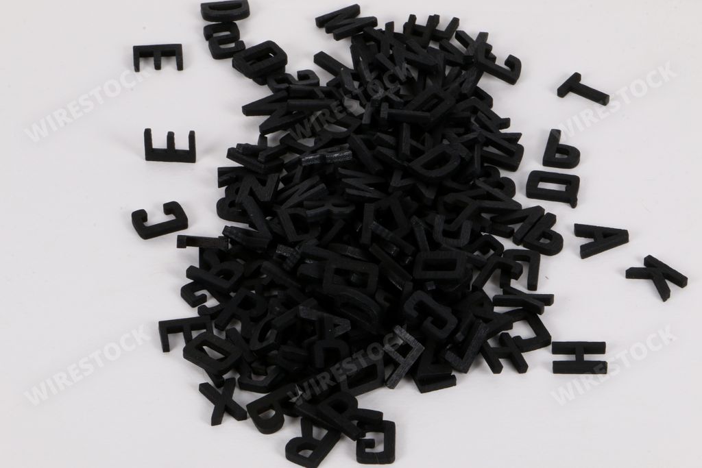 A closeup shot of wooden letters on a white background