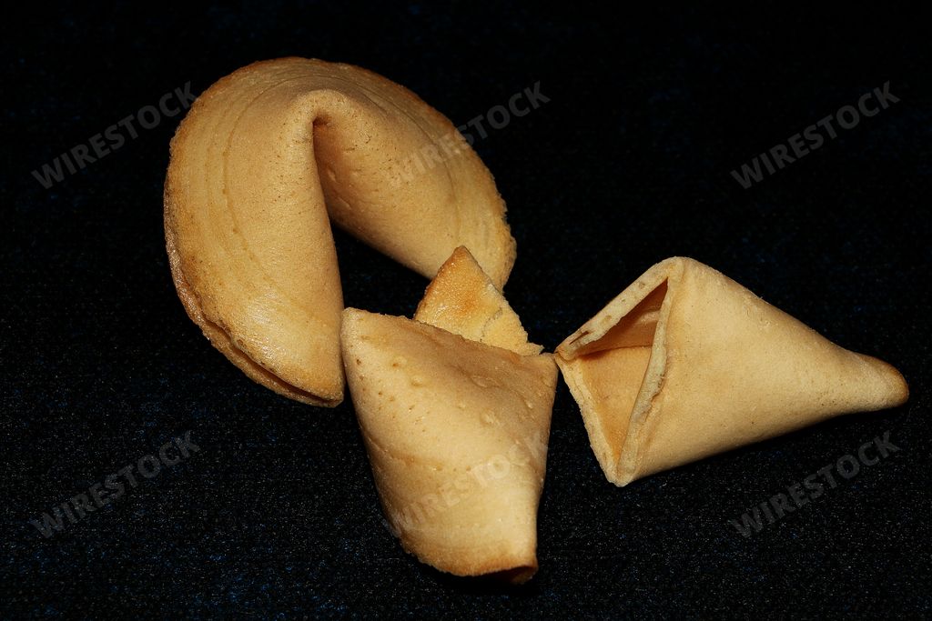 A closeup shot of fortune cookies on a dark background