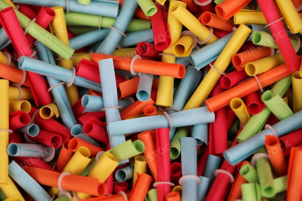 A closeup of a heap of colorful tombola tickets as a background