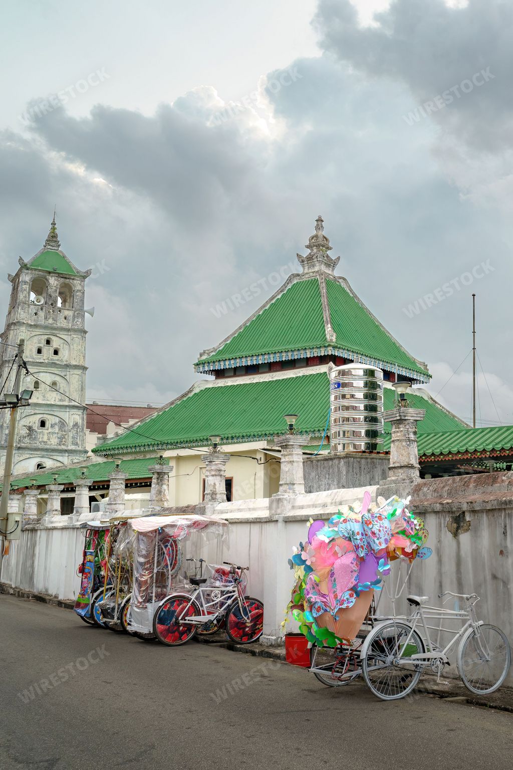 Beautiful trishaw parking near the historic Kampung Kling mosque built in 1748 in the city of Malacca Malaysia.