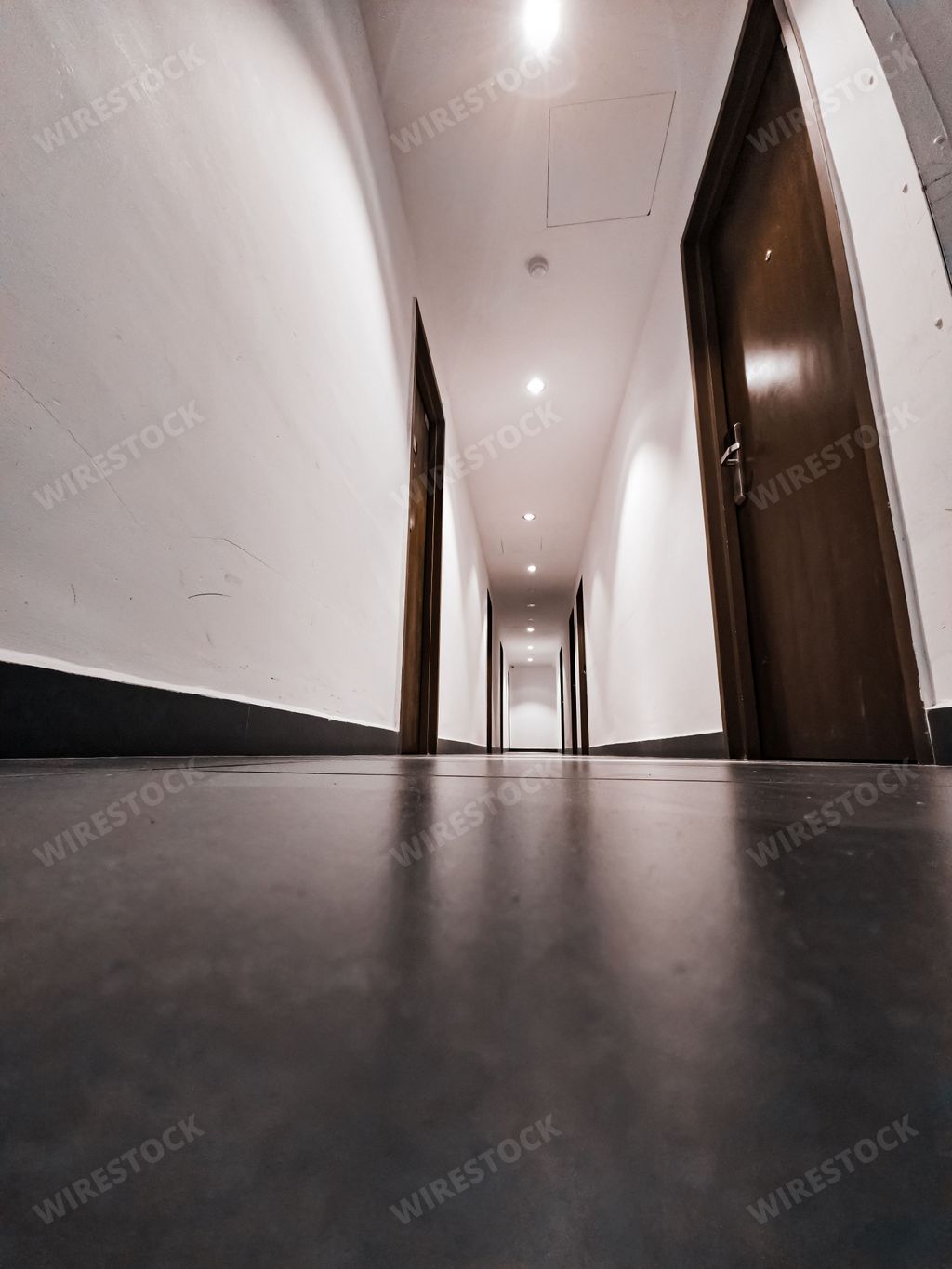 The interior of a simple minimalist hotel corridor