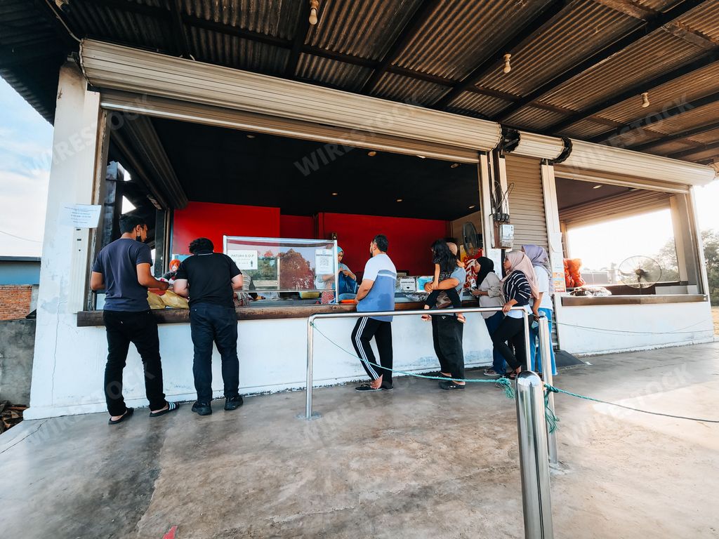 A queue at the Bayu Keropok Lekor shop selling fish sausage crackers.