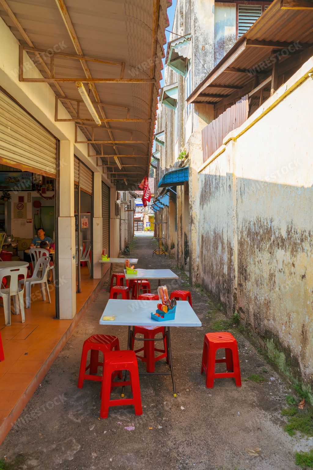 Perak, Malaysia - Aug 12, 2022 : Chinese restaurant at the alley of  an old town of Tapah in the morning.