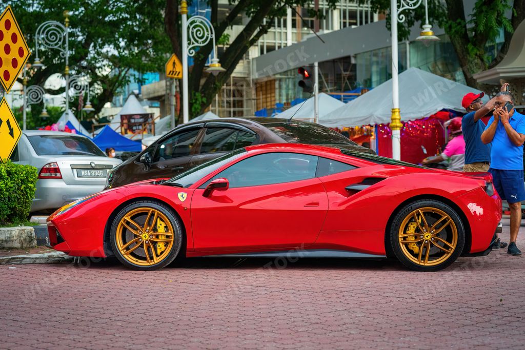 Brickfields, Malaysia - Oct 22, 2022 A red Ferrari 488 GTB parked at Little India town. The Ferrari 488 is an Italian sports car produced since 2015.