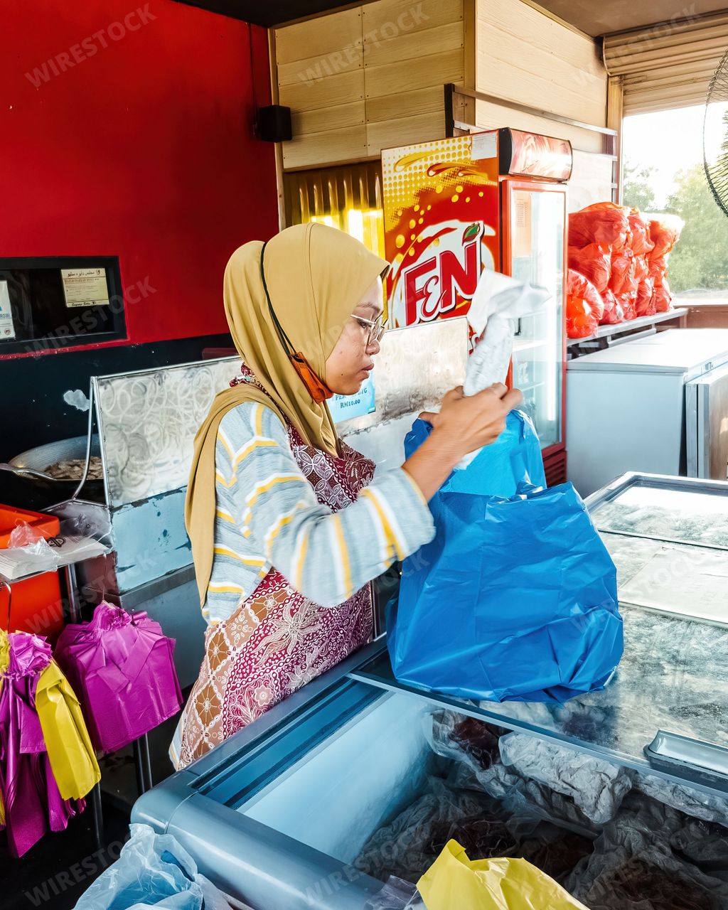 Setiu, Terengganu - May 11, 2022 : Bayu Keropok Lekor workers selling fish sausage crackers.
