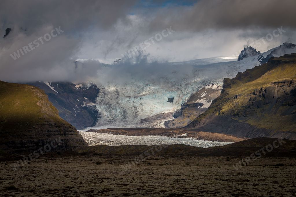 A scenic view of the Kviarjokull Glacier in Iceland in the mist