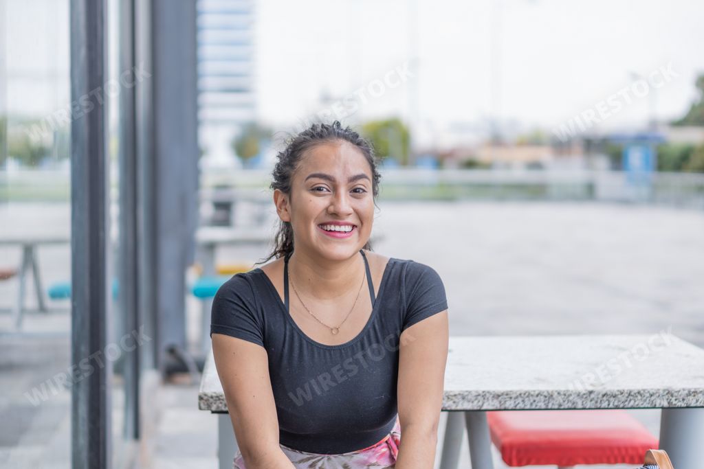 A Hispanic young female enjoying her day outdoors