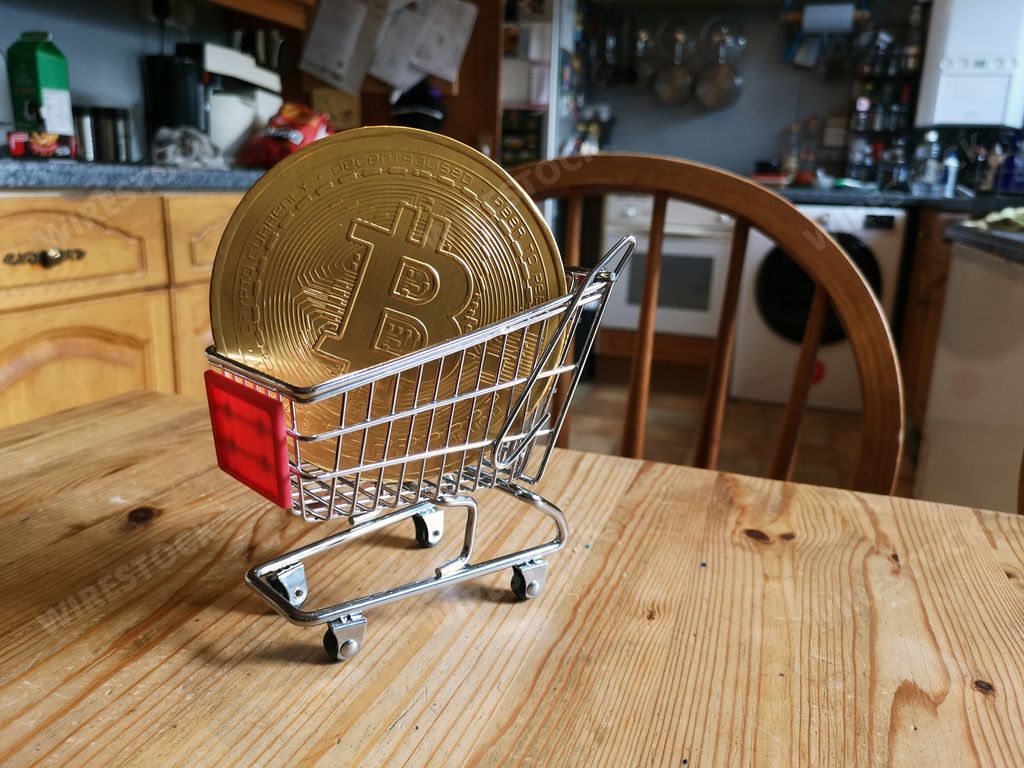 A closeup of the bitcoin in the shopping cart on the kitchen table.