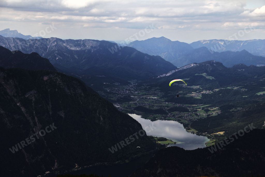 Paragliding over the lake of Hallstatt in the Austrian alps