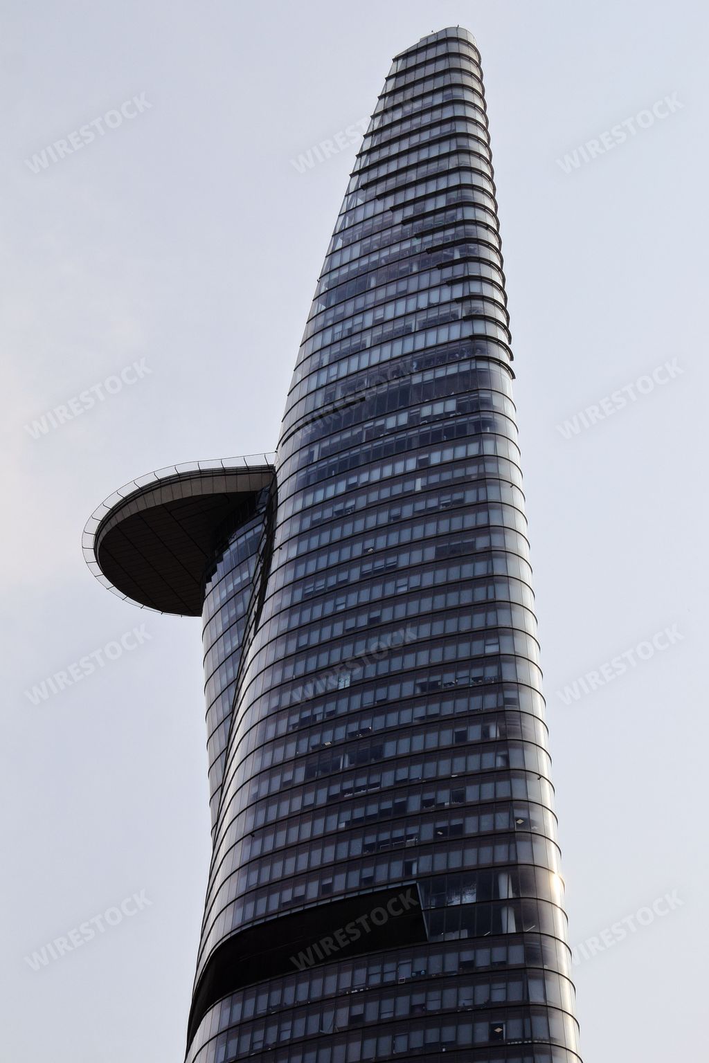 A vertical low angle shot of a modern tower building in Ho Chi Minh city in Vietnam