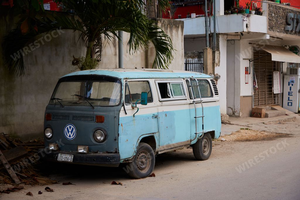 A pretty old blue Volkswagen bus parked on street in Tulum, Quintana Roo, Mexico
