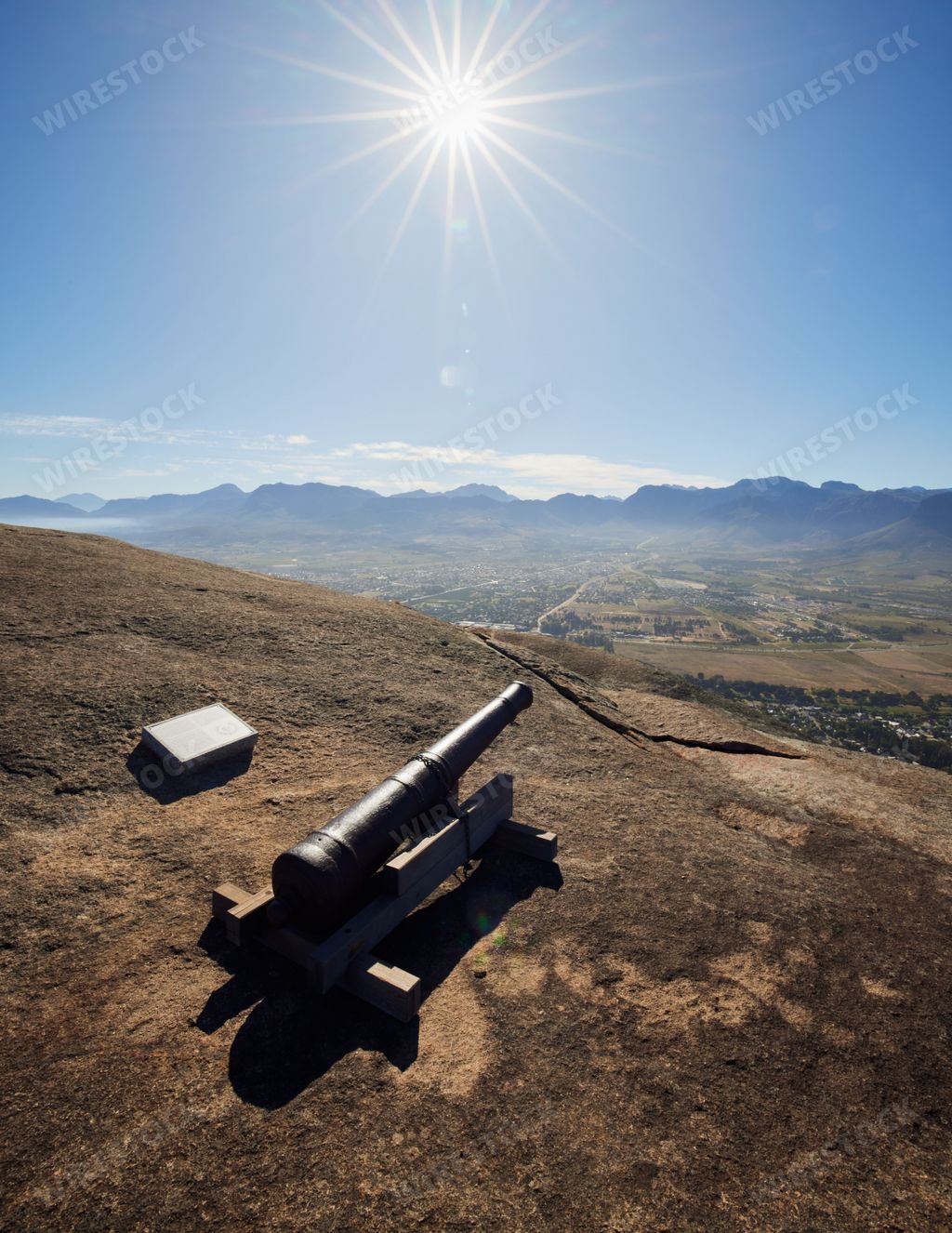 A vertical shot of a historic alarm cannon situated at Paarl Rocks in Paarl, South Africa