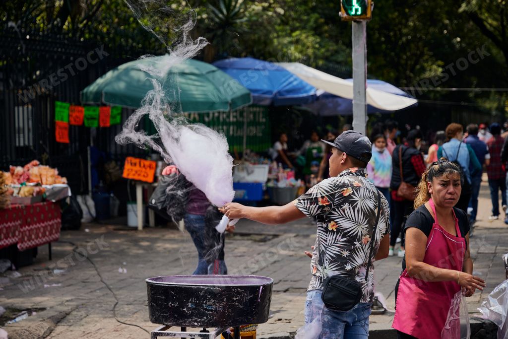 A man selling sugar candy cotton men during pandemic in Mexico