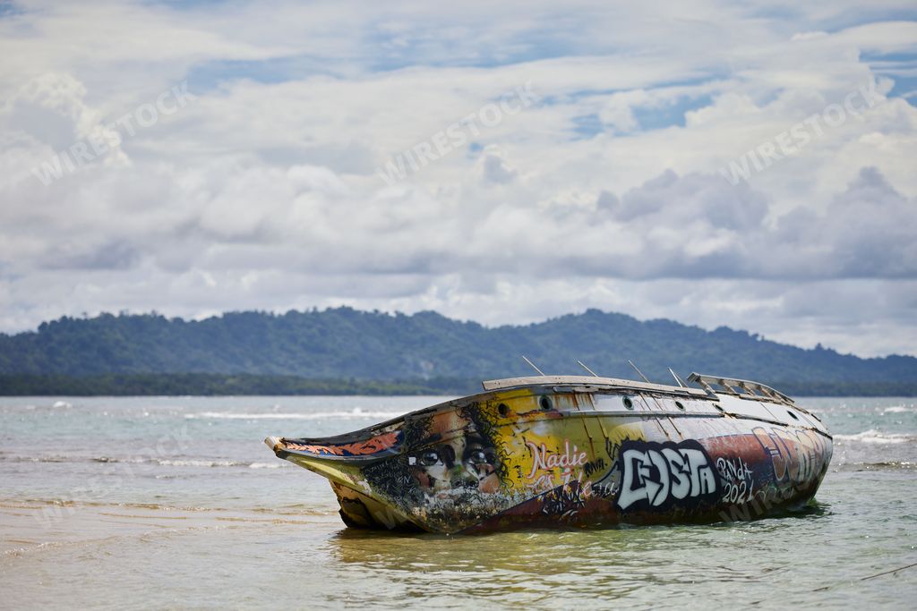 A wrecked ship with painting on the beach in Puerto Viejo, Costa Rica