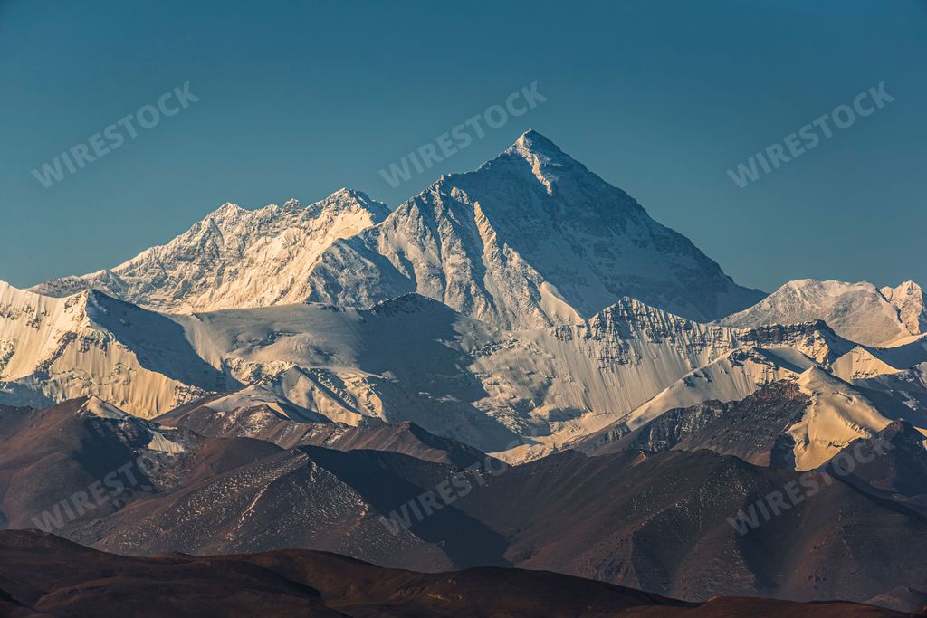An aerial view snow covered Everest mountain landscape