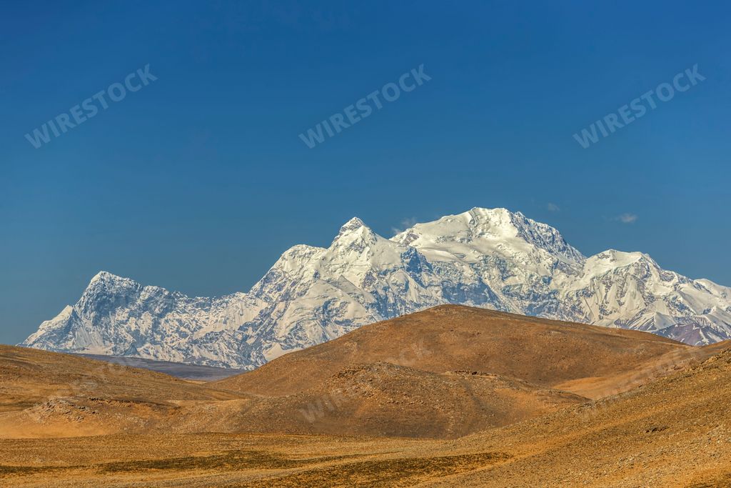 The snowy mountains and the moon in the Himalayas in Dingri County, Xigaze, Tibet, China