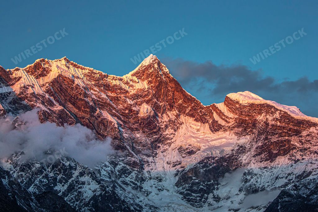 A landscape of the peaks of the Himalayas on a sunny day in Nyingchi, Tibet, China