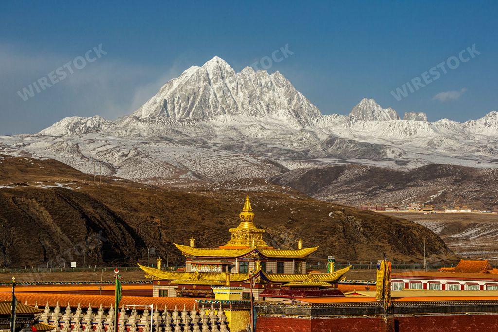 A beautiful shot of the Tagong temple and Yala snowy mountain in Sichuan, China