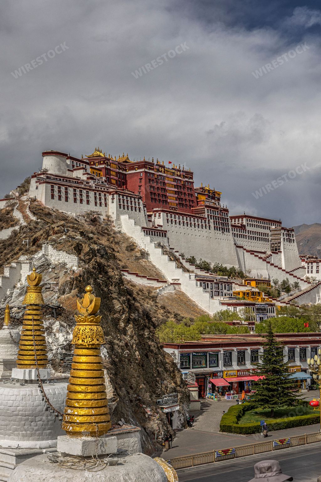 A vertical shot of a White Pagoda and Potala Palace in Lhasa, Tibet,China