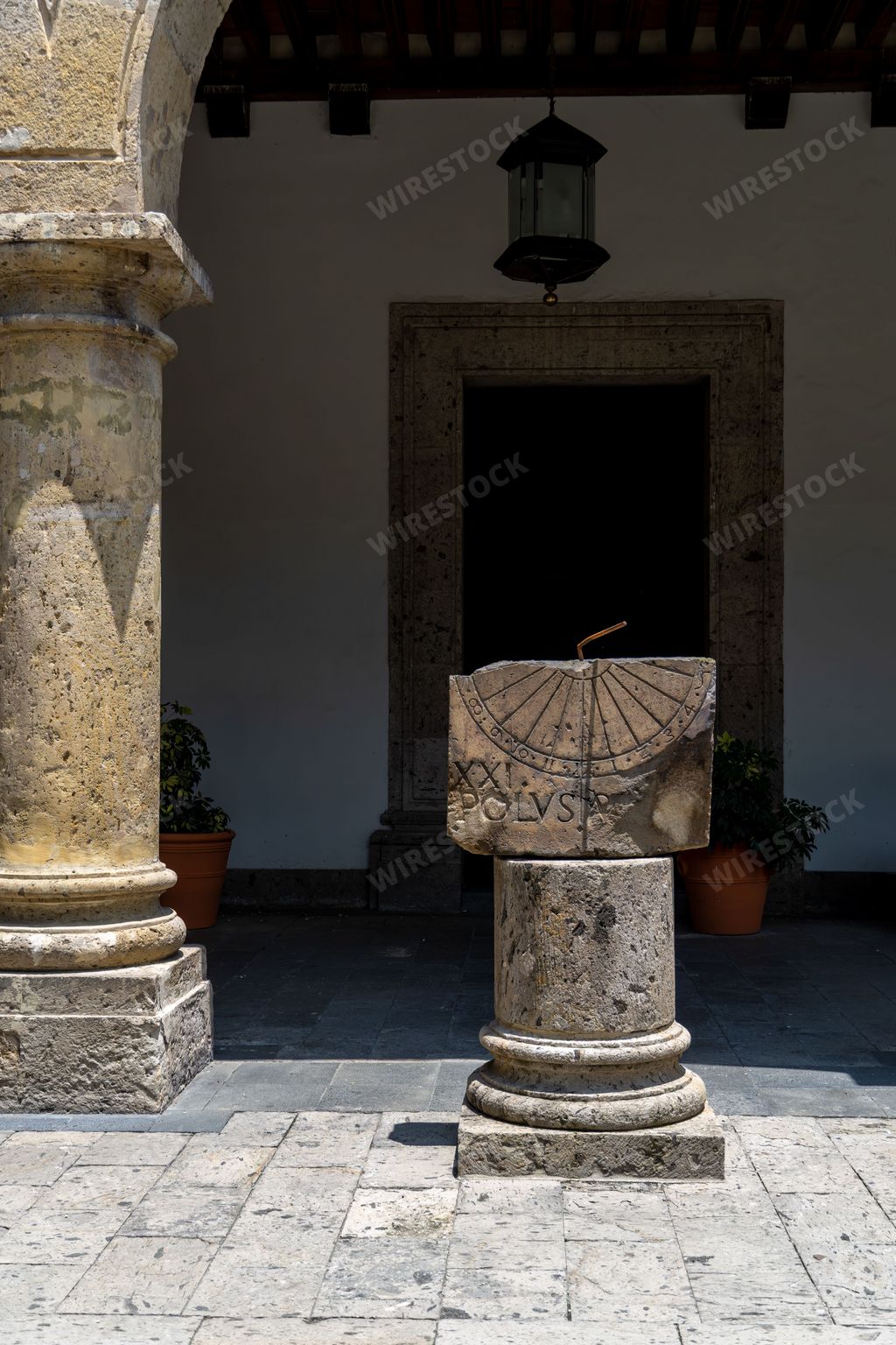greek columns and a sundial inside a building, mexico guadalajara latin america