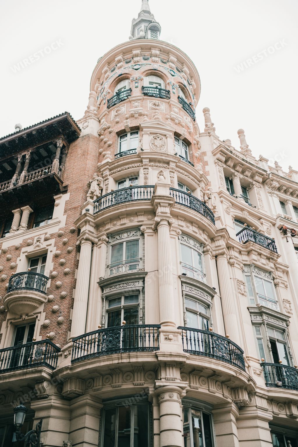A low angle view of a castle with balconies on a sunny day
