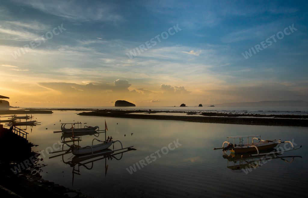 A beautiful shot of boats at dawn in Candi Dasa, Bali, Indonesia