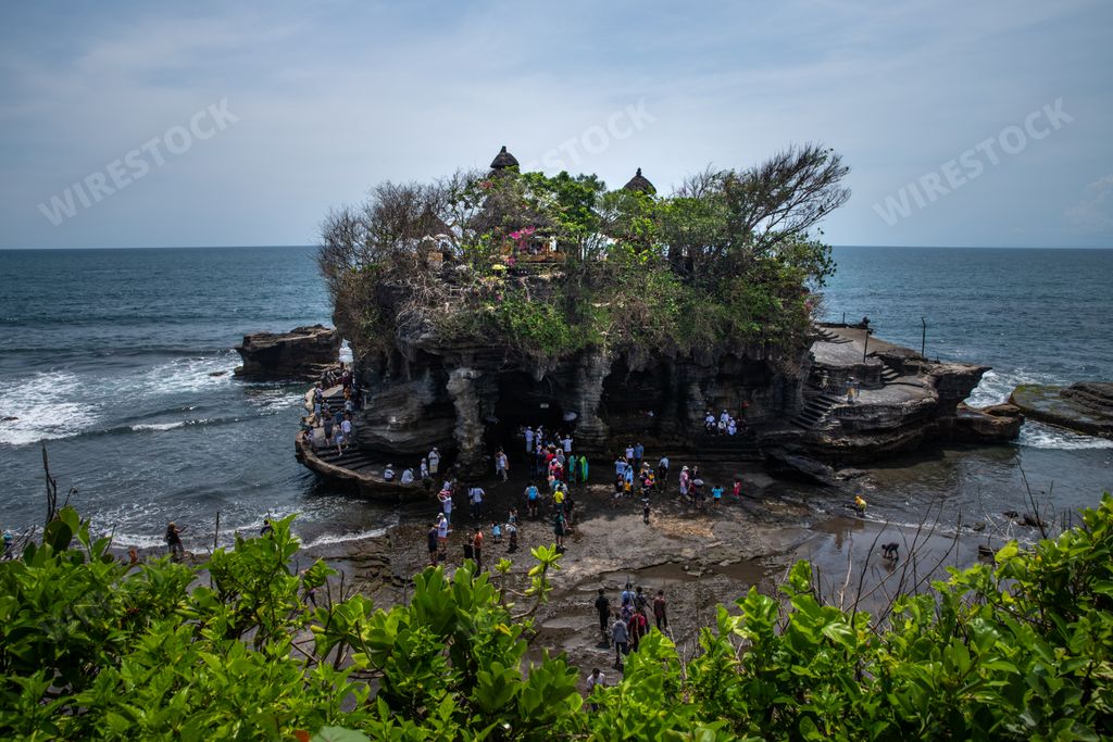 The cloudy sky over the Tana Lot temple and the sea in Bali, Indonesia