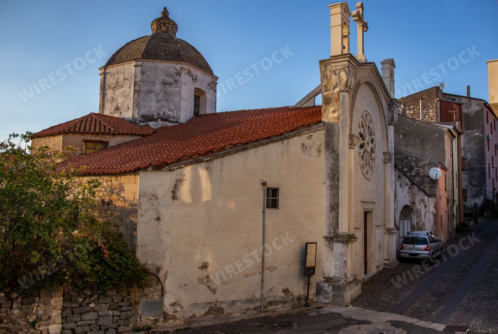 A closeup of a small church in Sardegna, Italy under a clear blue sky