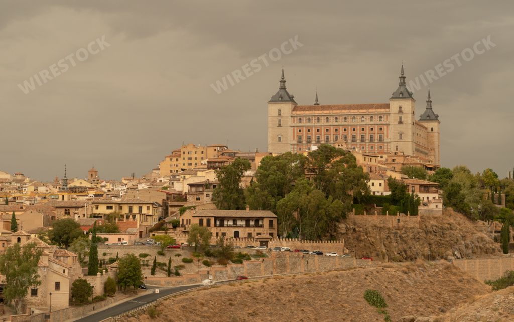 A mesmerizing view of Alcazar de Toledo fortification under the cloudy sky in  Toledo, Spain