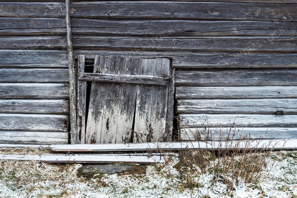 An abandoned summer barn door located high up amongst the Totenasen Hills in Norway