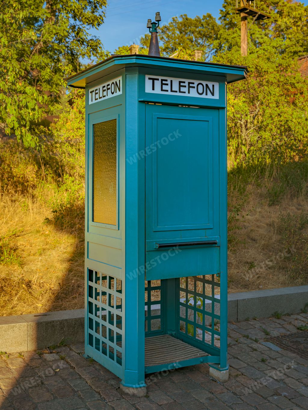 A traditional blue telephone booth at the Skansen open air museum, Stockholm