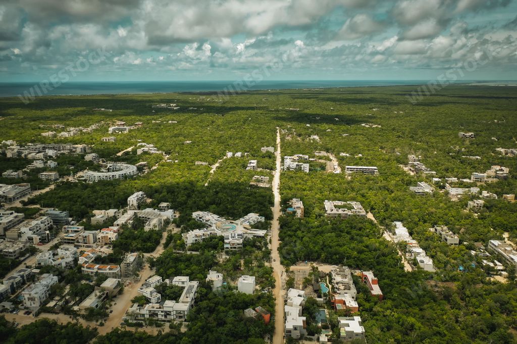 A view of Tulum, Mexico from the air under a cloudy sky