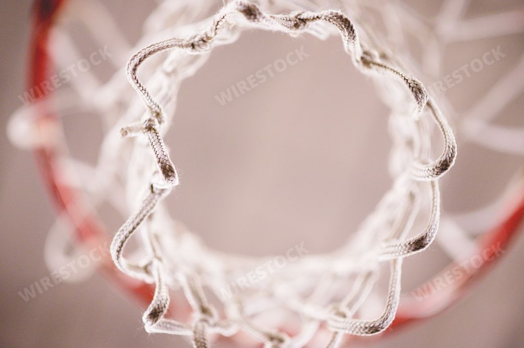 A closeup low angle shot of basketball net in the basketball court