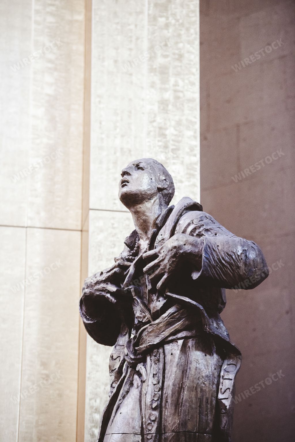 A vertical shot of a religious statue near the church in Zacatecas Mexico
