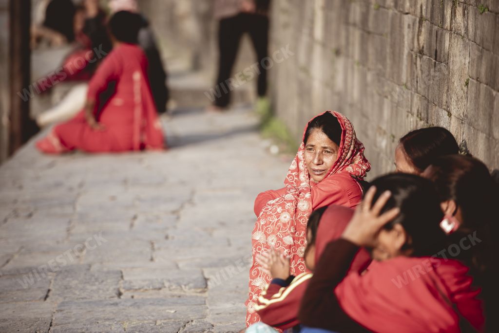 Group of Woman talking outside of a Hindu Temple.