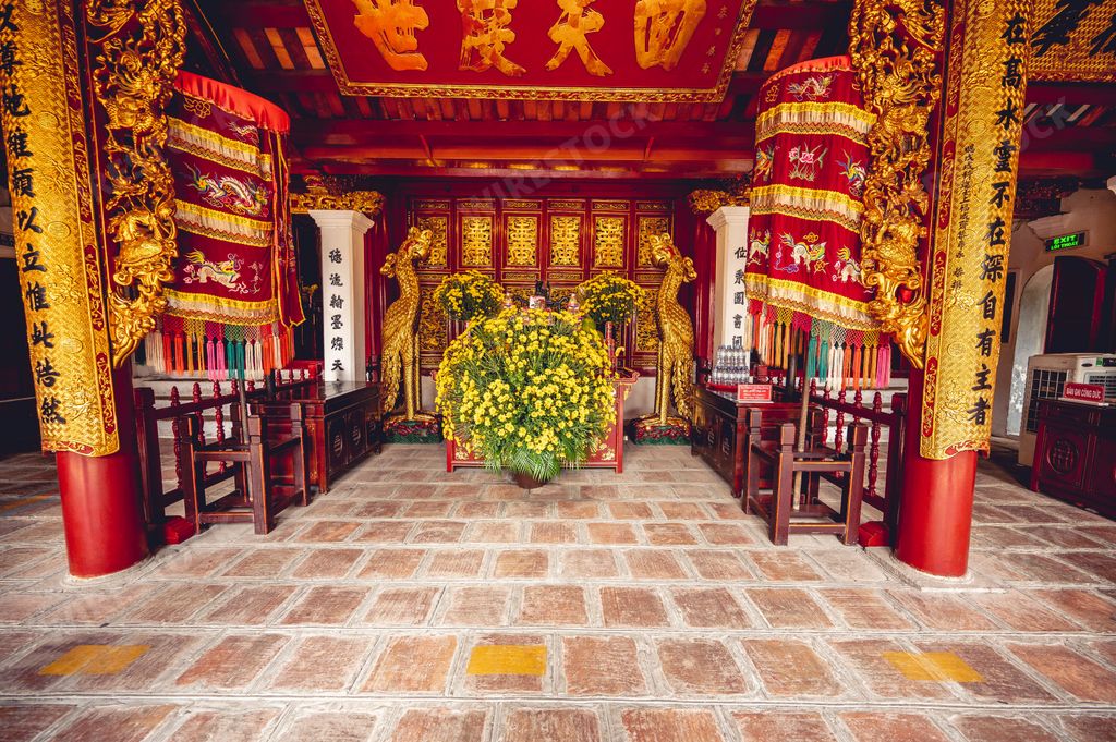 The beautiful gold and red adorned exterior of a Buddhist temple in Vietnam