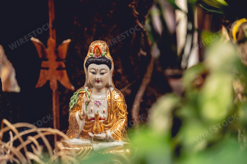 The golden Buddha decoration on an altar of a Buddhist Temple