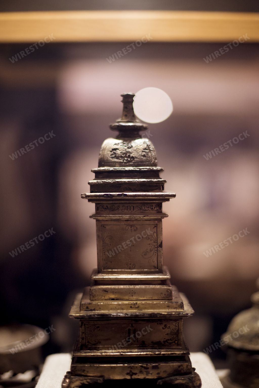 A vertical shot of a shipwreck treasure behind a blurry background