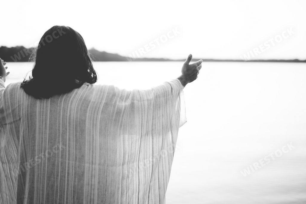 A biblical scene - of Jesus Christ with his hands up in black and white