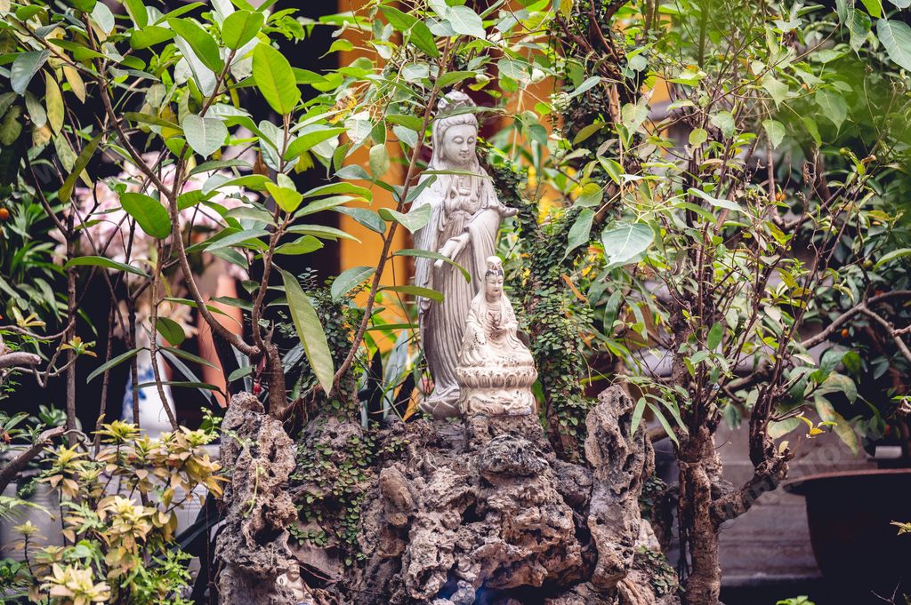 A closeup shot of Buddhist idols outside a temple in Vietnam