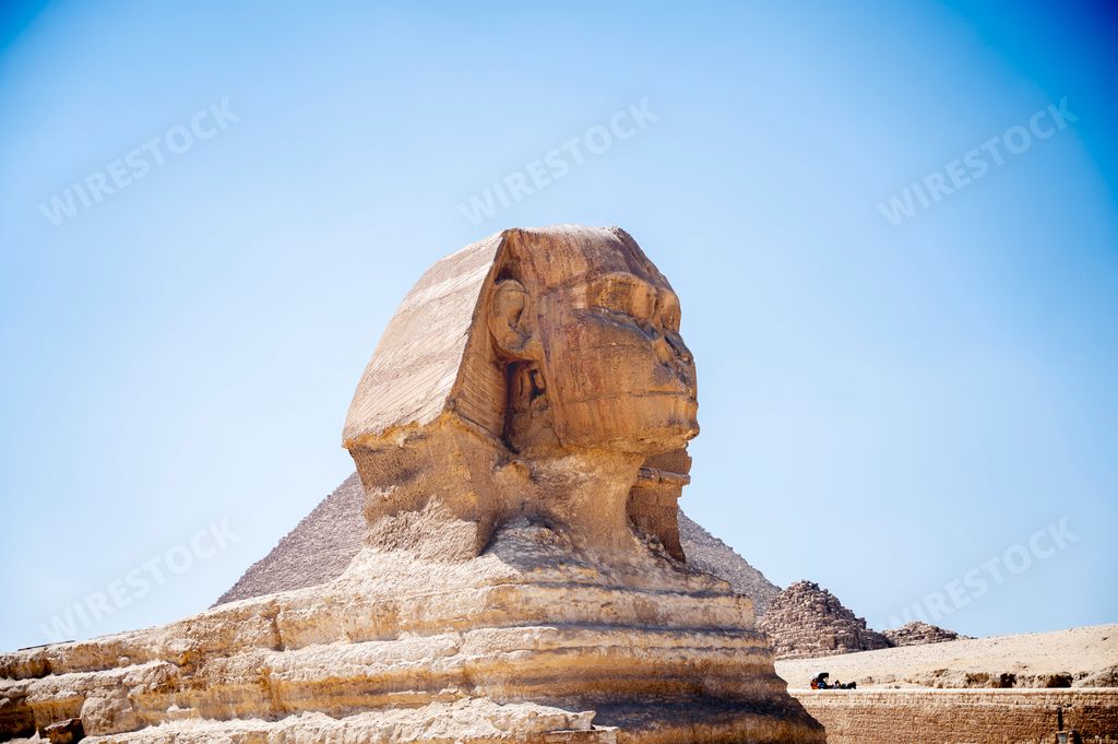 The famous statue of Sphinx in the background of the Great Pyramids, Cairo, Egypt