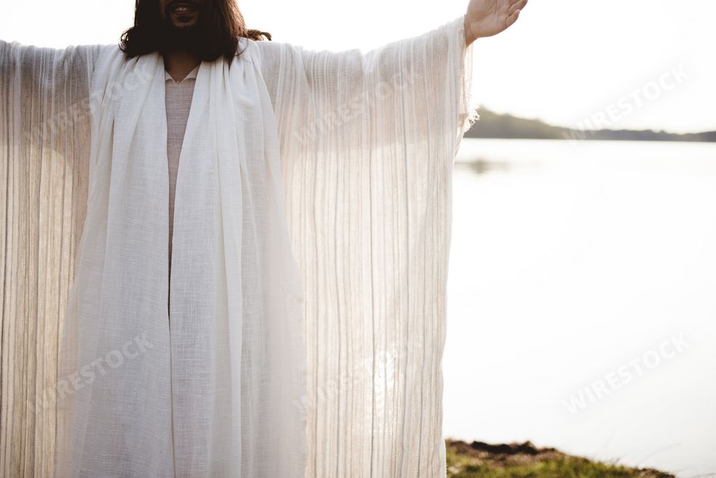 biblical scene - Jesus christ praying with a blurred shoreline in the background