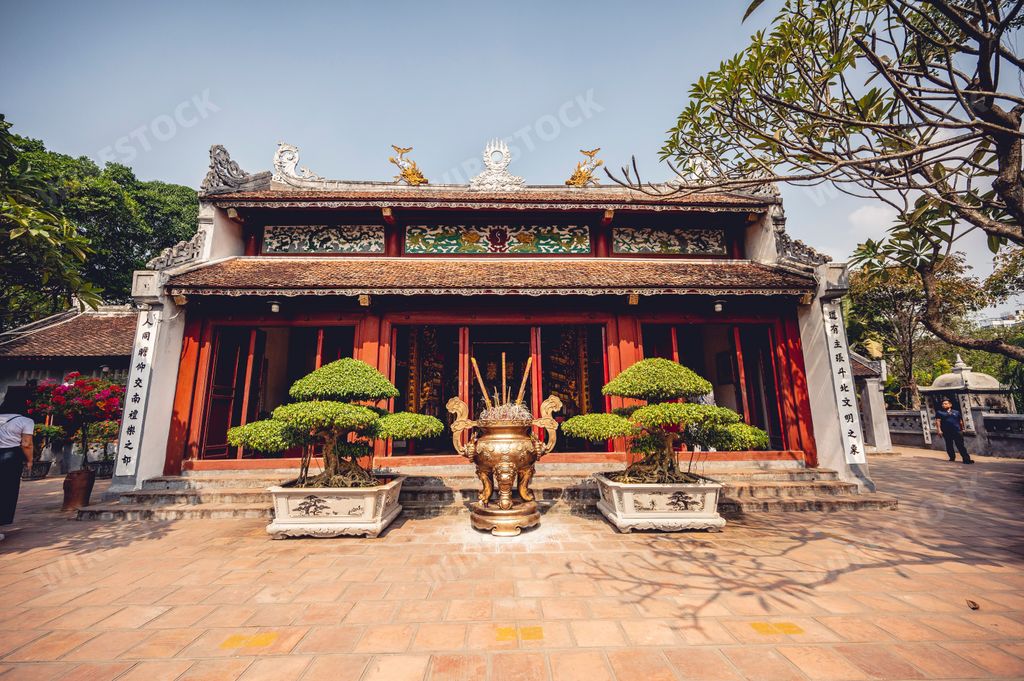 The burning incense on an altar of in front of a Buddhist Temple in Vietnam