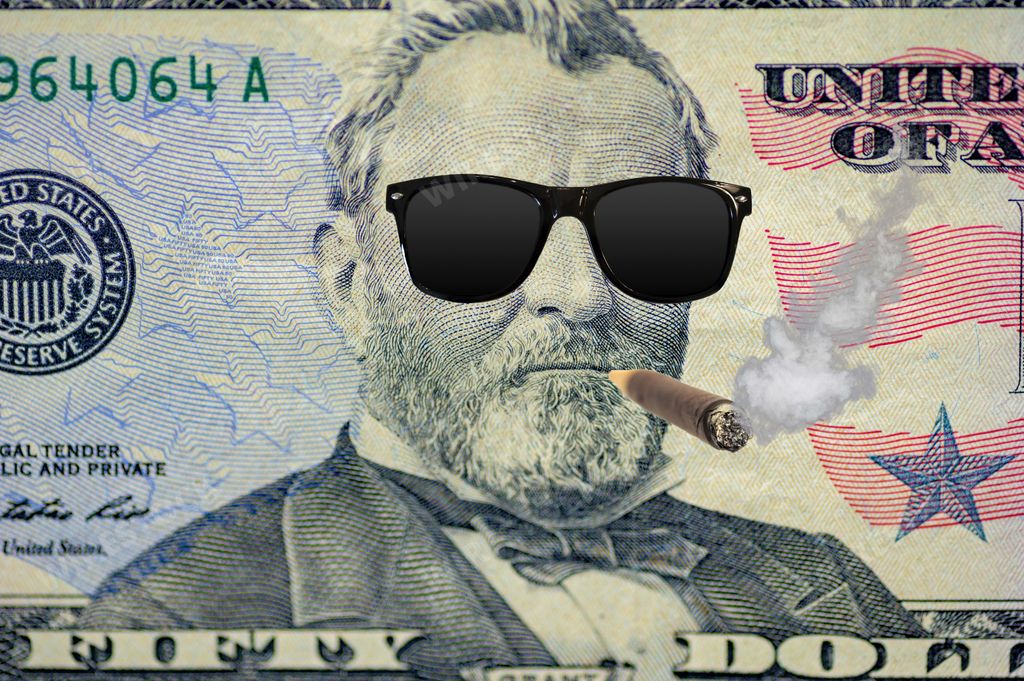 A closeup shot of the Ulysses s. grant on the dollar bill with sunglasses and a cigar
