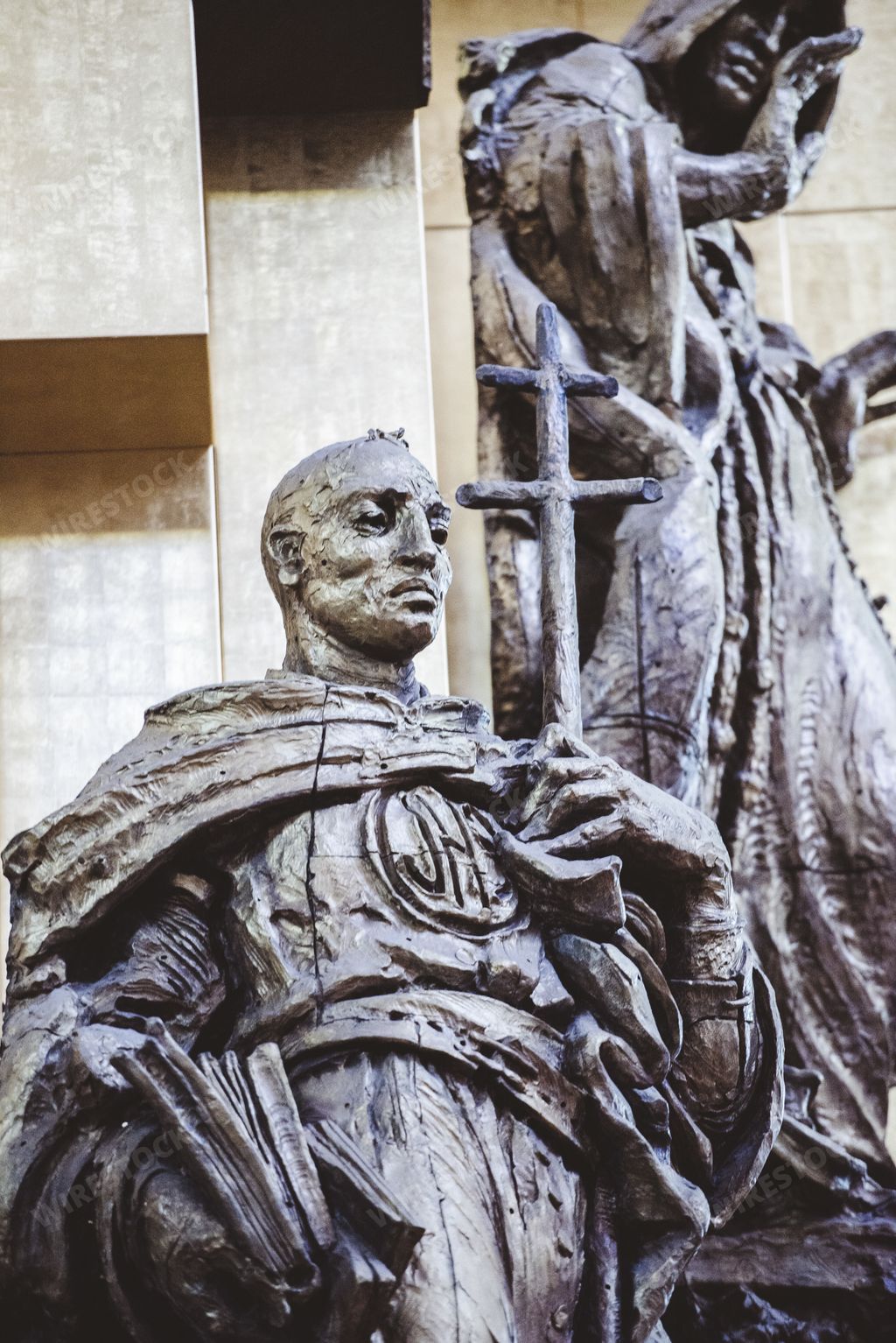 A closeup shot of a religious statue with a blurred background